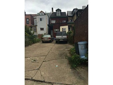 Parking Lot/Garage. REAR PARKING PAD LARGE ENOUGH 