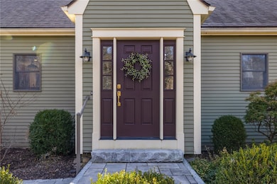 A granite step and walkway are classic features of