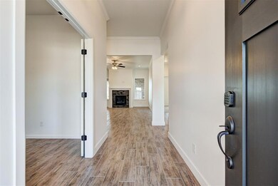 Corridor featuring crown molding, baseboards, and 