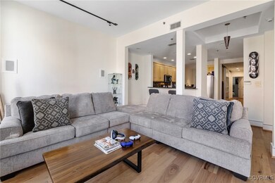 Living room with light wood-type flooring, visible