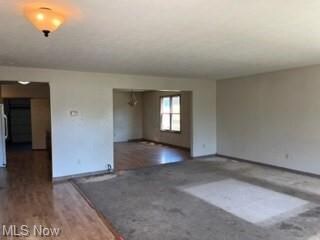 Spare room with hardwood flooring