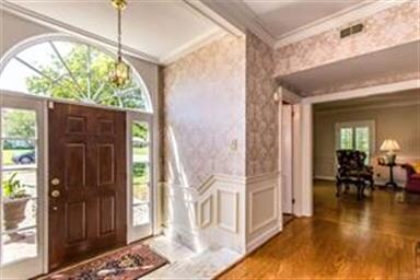 What an impressive entry way! This home was built 