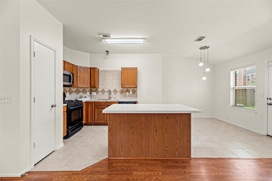 New quartz island counter top compliments this ope