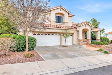 Mediterranean / spanish-style home with a garage,