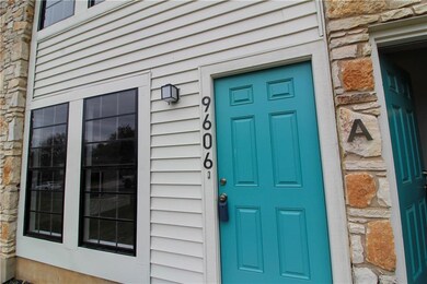 Property entrance with stone siding