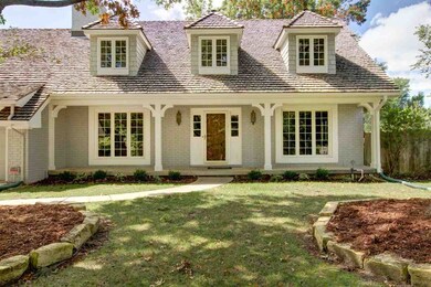 Dormer windows are featured on the second floor of
