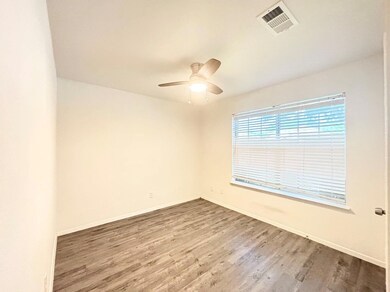 Empty room featuring hardwood / wood-style floors 