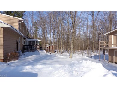 The three season sunroom leads out to fenced back 