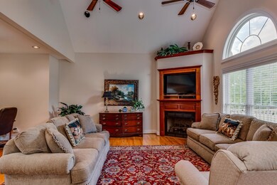Large living room with beautiful fireplace.