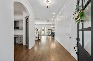 Step inside to discover fresh designer paint, beautiful hardwood floors flowing throughout, and thoughtful details that create a welcoming first impression.
