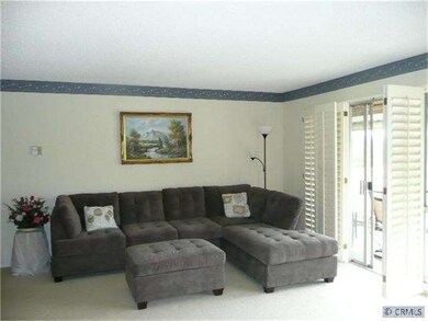 living room with sliding door access to balcony