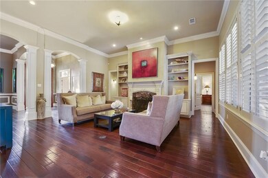 Living room with fireplace and custom built ins