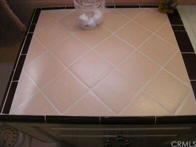 Close-up of bathroom tile.  Does that look new, or