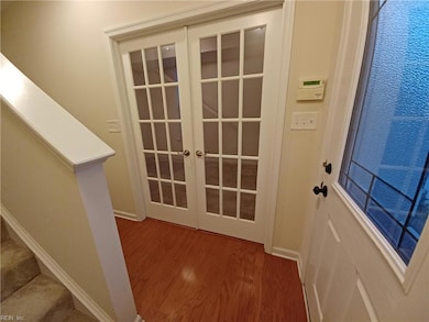 Entry froyer with the extra room off to the right with French doors.