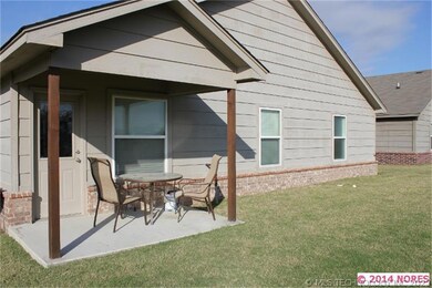Covered porch overlooking pond.