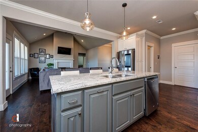 Large kitchen island with granite countertops and