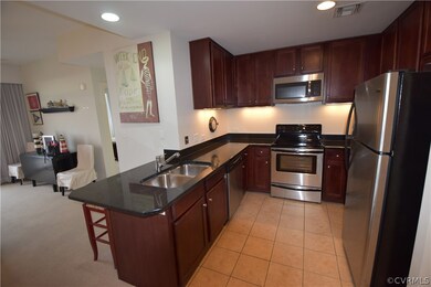Kitchen has cherry cabinets, stainless appliances