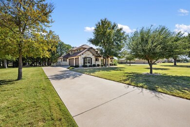 Craftsman-style home with stone siding, concrete driveway, a front yard, and a garage