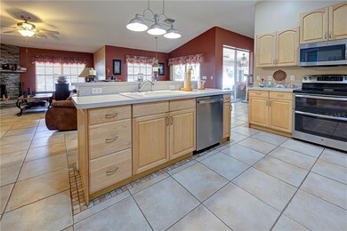 Stainless steel GE appliances with custom kitchen cabinets.  Double oven!