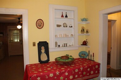 This area has room for a table and has great storage in built in cabinets.