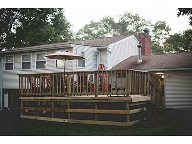 Exterior Back. Deck off of the sunroom.