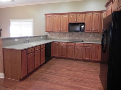 Beautiful cabinetry, Corian countertops, sleek app