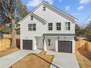View of front of property featuring concrete drive