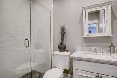 First floor guest room en-suite bathroom includes