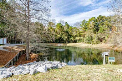 Home is adjacent to a 1 acre pond with fountain.