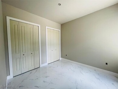 Unfurnished bedroom with multiple closets, light m