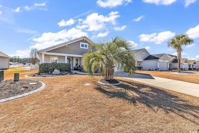 View of front of home with covered porch, driveway