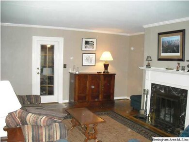 Living room opens onto screened porch
