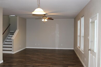 Unfurnished room with wood finished floors, baseb
