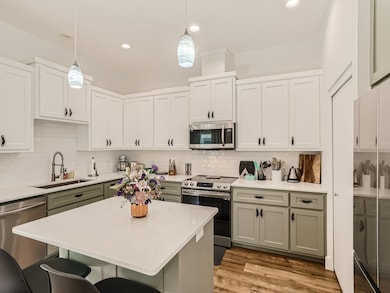 Kitchen featuring appliances with stainless steel