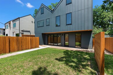 Rear view of property featuring board and batten 