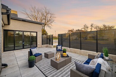 Patio terrace at dusk featuring an outdoor hangout