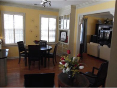 Dining room has two built-in cabinetries, hardwood