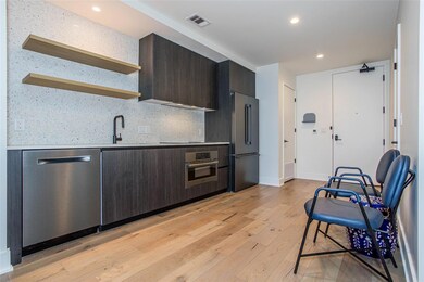Kitchen featuring stainless steel appliances, dar