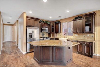 Kitchen features a largle island and custom cabine