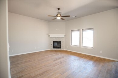 Unfurnished living room featuring light hardwood /