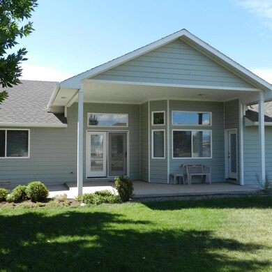 Entrances from patio to kitchen & master