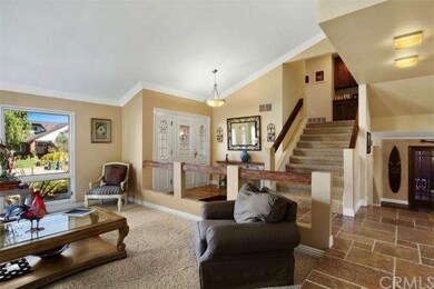Gorgeous travertine floors welcome you into the ho