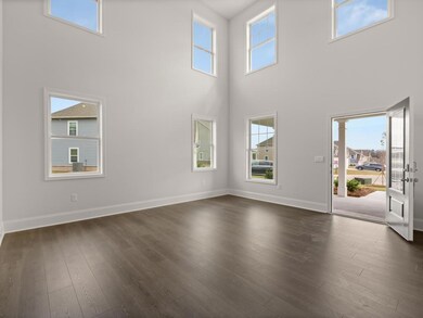 Westerly front foyer with multiple windows for abundant natural light