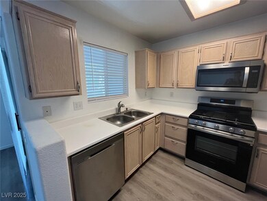 Kitchen with appliances with stainless steel finis
