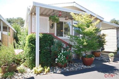Inviting front entrance with easy care landscape.