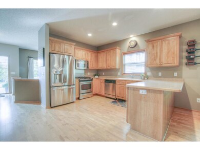 Upgraded SS appliances and gleaming Maple hardwood