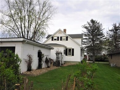 Rear view of garage and House