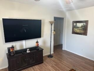 Living area with baseboards, a ceiling fan, and wo