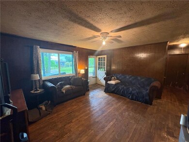 Living room featuring wood-type flooring, a ceilin