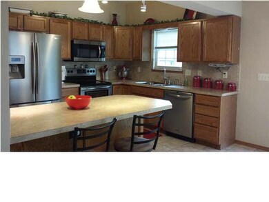 KITCHEN WITH STAINLESS STEEL APPLIANCES, ISLAND, &